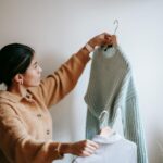 person comparing charts on screen