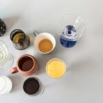 assortment of glass and steel carafes