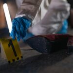 forensic pathologist examining evidence