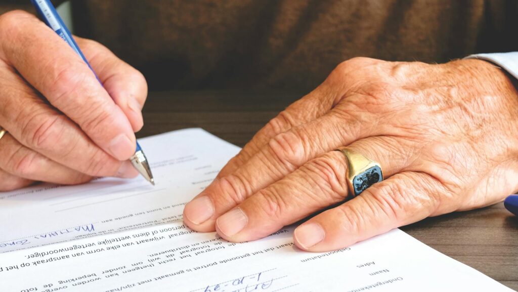 person signing business contract
