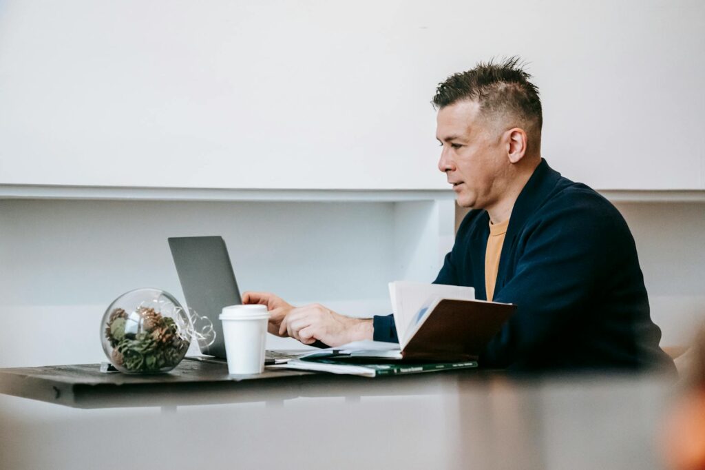 person working at desk with headphones
