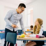students teaching science internationally