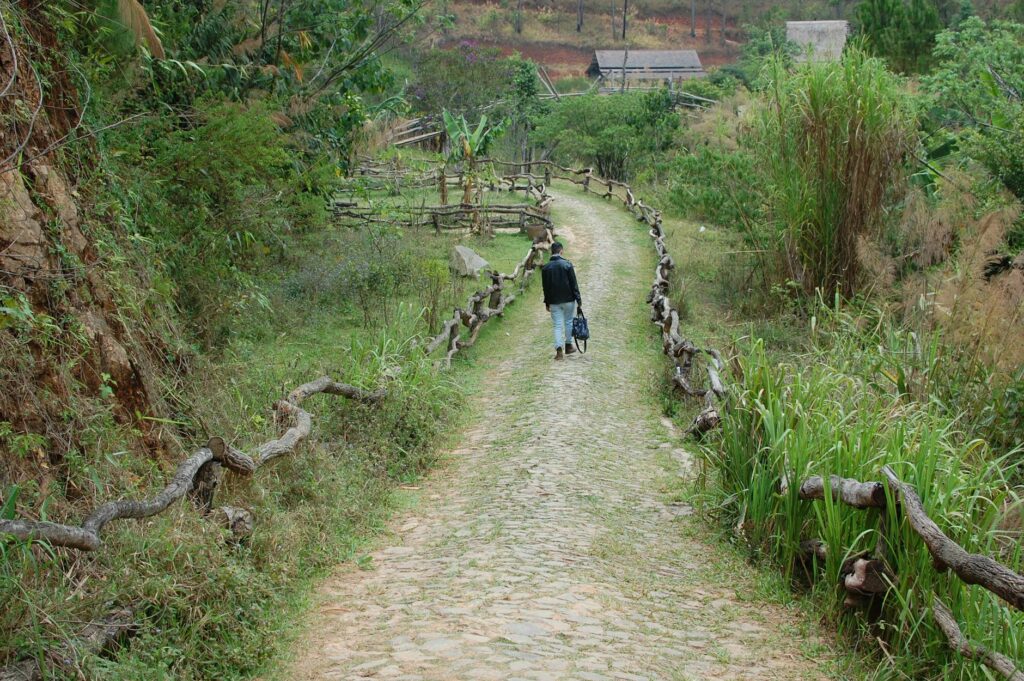 traveler walking on Boston cobblestone street