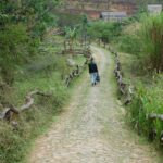 traveler walking on Boston cobblestone street