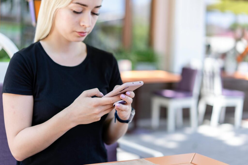 woman using phone with eSIM